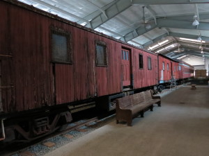 Some of the historic wood cars awaiting restoration housed inside the Railway Historic Center structure.