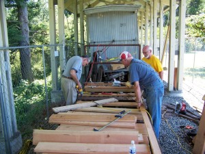 Russ Segner and crew during restoration of historic flat car.