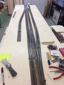 A 2 section Free-mo module (5'-1" & 4' = 109"); track is down and secured, ready to install Tortoise motors and wiring. Construction and photo by Lee Chessman. 