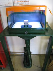 The downdraft adaptor was fabricated by Lynden Sheet Metal and the booth itself was fashioned from a plastic storage bin. 